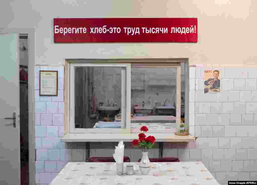 The bunker’s canteen. The facility had enough supplies to feed 250 people for three months. The banner says "Don't waste bread, it is the work of a thousand people!" 