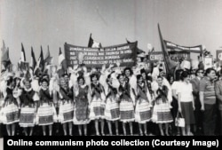 Women in the northwestern Bihor county, which has a sizable ethnic Hungarian community, welcome Ceausescu. The sign displayed in the background reads like a poem: “Romanians and Hungarians, we are fulfilling our duty; arms stronger, minds more beautiful; the Party, Ceausescu, Romania, are for us the world's most precious things.”