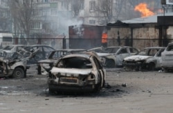 Последствия обстрела украинского города Мариуполь из установок "Град" в январе 2015 года
