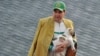 Turkmen President Gurbanguly Berdymukhammedov holds an alabai puppy as he takes part in celebrations for the Day of the Horse in Ashgabat in 2018.