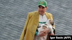 Turkmen President Gurbanguly Berdymukhammedov holds a Turkmen shepherd dog as he takes part in celebrations for the Day of the Horse in Ashgabat in April 2018.