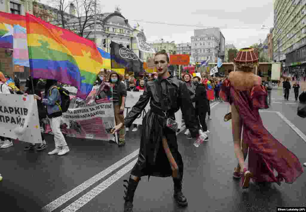 People take part in the annual Gay Pride parade under the protection of riot police in Kyiv on September 19.