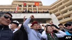 Supporters of Kyrgyz Prime Minister Sadyr Japarov attend a rally near the Ala-Archa presidential residence in Bishkek on October 15. There are suspicions that organized-crime groups are supporting Japarov.