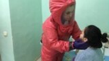 Kazakhstan - doctor Bakhyt Otegenov checks patient who has the coronavirus