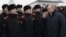 Russian President Vladimir Putin (right) meeting with military cadets last month.