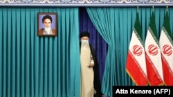 Iranian Supreme Leader Ayatollah Ali Khamenei arrives to cast his ballot in the country's presidential election on June 18. 