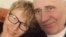 A picture released on February 19 shows Belarusian opposition figure Mikalay Statkevich (right) and his wife, Marina Adamovich, at their home in Minsk following his release.