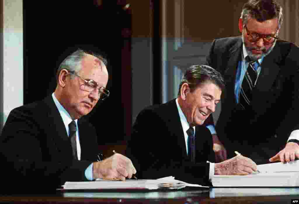 Reagan and Gorbachev sign the Intermediate-Range Nuclear Forces (INF) Treaty in the East Room of the White House on December 8, 1987.