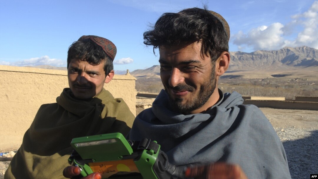 Dutch soldiers gave a radio to these villagers in Afghanistan's southern Uruzgan Province in January.