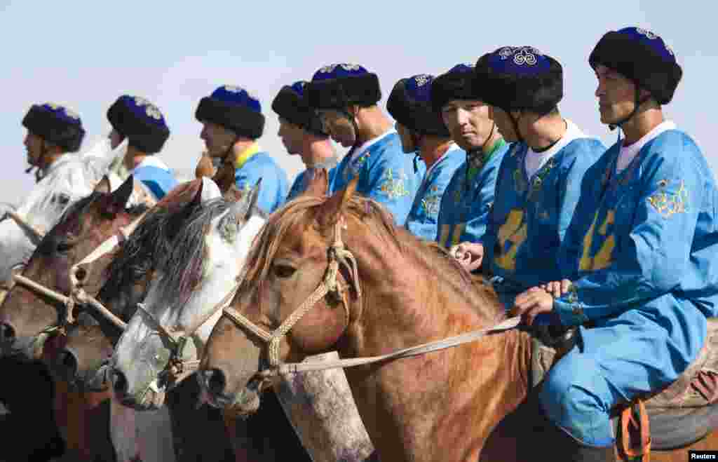 The team from Kazakhstan line up before a game during the first Asian kokpar championship in Astana.