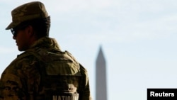 A member of the Louisiana National Guard patrols at the Lincoln Memorial November 27, 2025, a day after two National Guard members were shot in Washington, D.C.