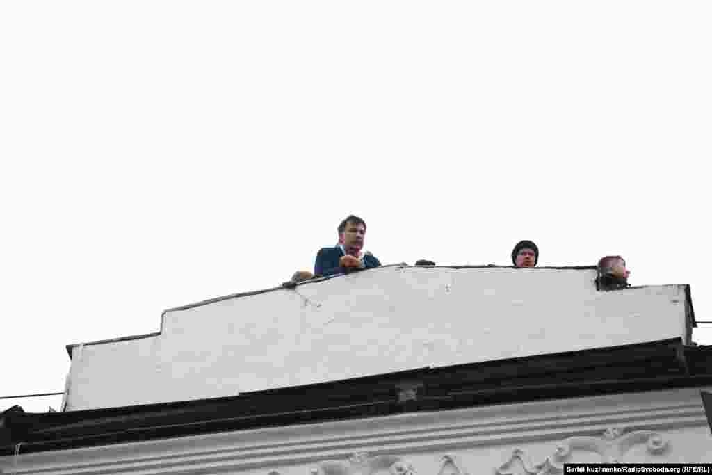 Mikheil Saakashvili, the former president of Georgia, ex-governor of Ukraine&#39;s Odesa region, and opponent of Ukraine&#39;s President Petro Poroshenko, shouts to supporters from the roof of the apartment building where he had been staying.&nbsp;