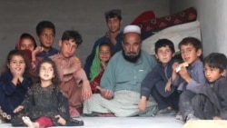 Afghans rest at a shelter in Khost, Afghanistan, after fleeing clashes along the Pakistan-Afghanistan border in March that displaced thousands of families.