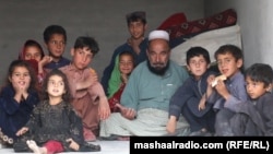 Afghans rest at a shelter in Khost, Afghanistan, after fleeing clashes along the Pakistan-Afghanistan border in March that displaced thousands of families.