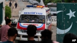 Ambulances leave from a complex near the site of a suspected Indian missile attack in Muridke, a town in Pakistan's Punjab province, on May 7.