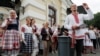 BELARUS -- People sing as they attend an opposition demonstration to protest against presidential election results in front of the Janka Kupala National Academic Theatre, in Minsk, August 20, 2020