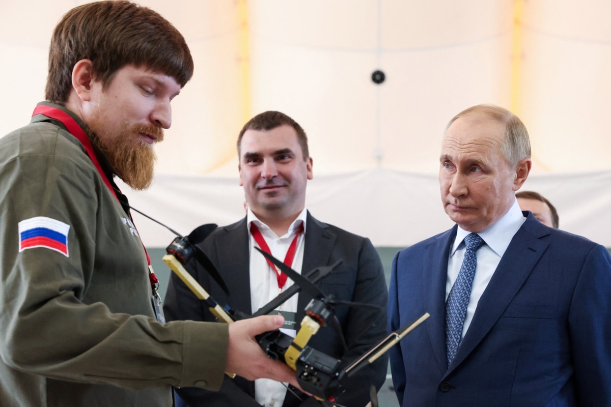 Volodymyr Tkachuk, co-founder of Ural Drone Factory, shows a drone to Russian President Vladimir Putin at the Special Technology Center facility in St. Petersburg, September 19, 2024