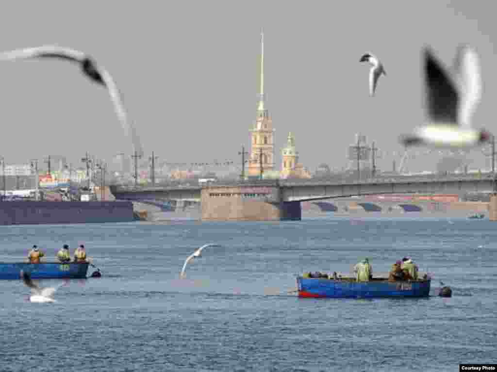 Photo: Alexander Belenky, "The St. Petersburg Times" - Fishing on the Neva with the Peter and Paul Fortress in the background