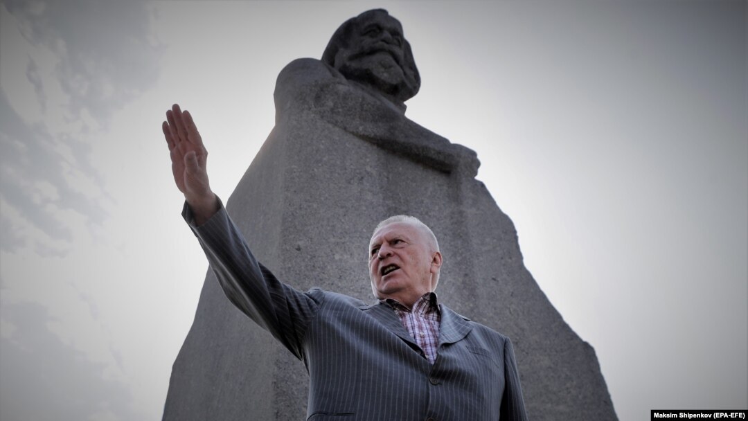 Vladimir Zhirinovsky meets with people next to a Karl Marx monument in Moscow in August 2021.