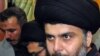 Shi'ite cleric Muqtada al-Sadr, surrounded by bodyguards, arrives in his stronghold of Najaf on January 5.