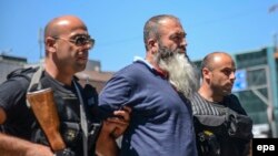 Jedno od hapšenja osumnjičenih za regrutovanje na ratišta u Irak i Siriju, Priština, avgust 2014