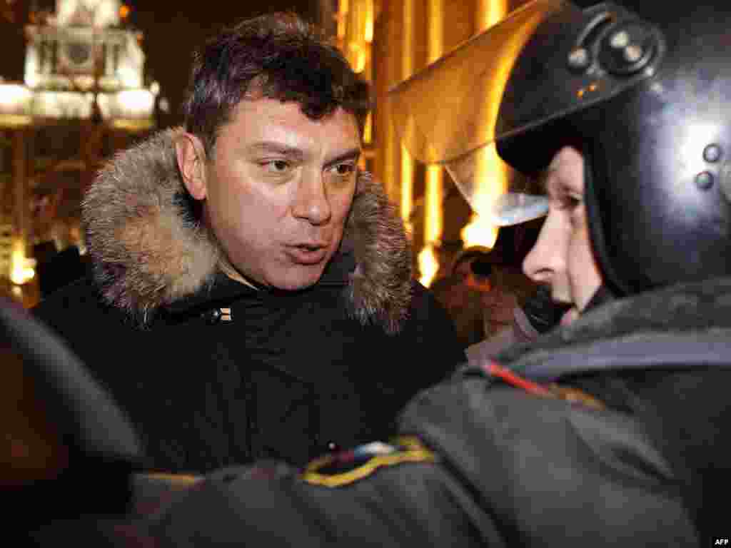 Opposition leader Boris Nemtsov was among 68 people detained by riot police in Moscow.