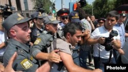 Armenia - Police detain a youth activist protesting against bus fare hikes in Yerevan, 23Jul2013.
