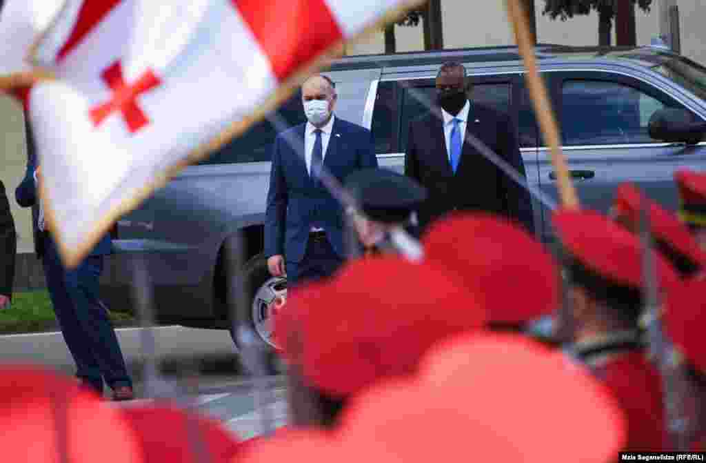 U.S. Defense Secretary Lloyd Austin (right) meets with Georgian Defense Minister Juansher Burchuladze in Tbilisi on October 18.