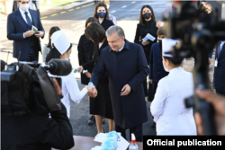 Uzbek President Shavkat Mirziyoev voting in Tashkent on October 24.