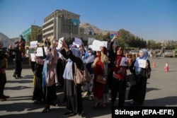 A group of Afghan women shout slogans during a protest in Kabul on October 21.