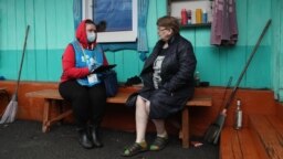 A census officer collects data from residents of the remote village of Ostrovnoye in Russia's Sverdlovsk region in April 2021. 