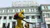 Servicemen of Russia's Emergency Situations Ministry wearing protective gear disinfect Moscow's Belorussky railway station on October 20 amid the ongoing COVID-19 pandemic.