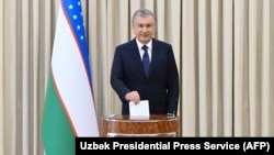 Uzbek President Shavkat Mirziyoev casts his vote in the presidential election on October 24.