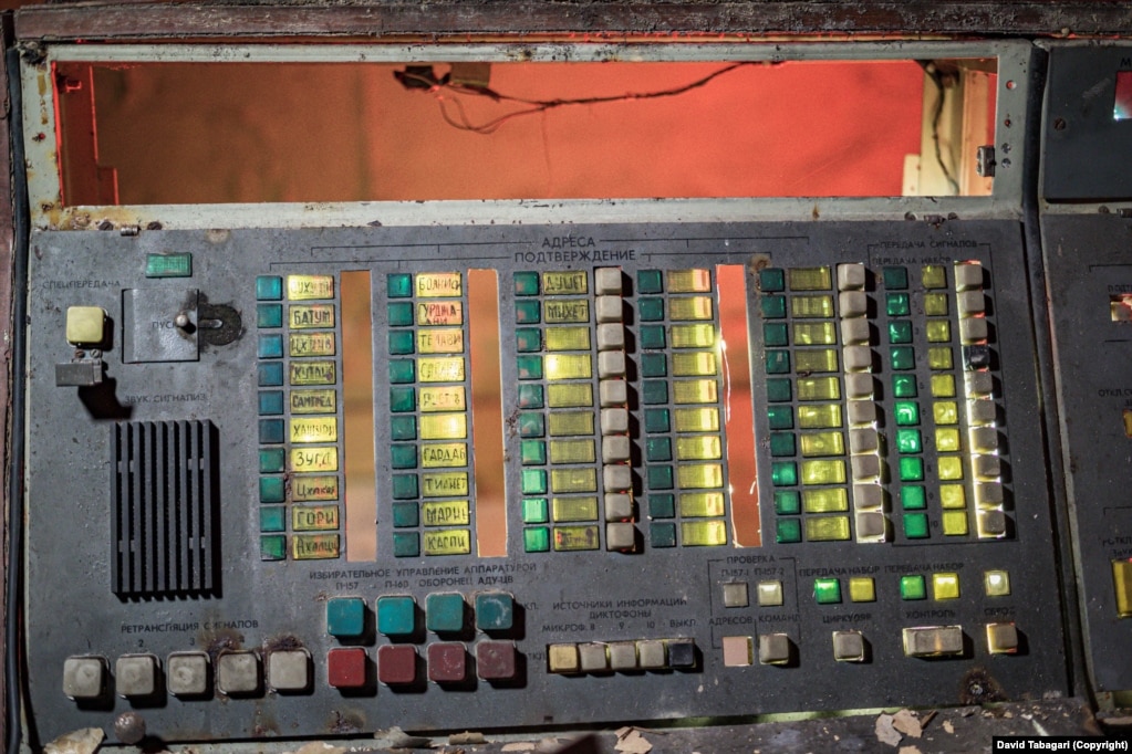 An apparent communications switchboard, with the names of several Georgian cities, in an underground shelter.