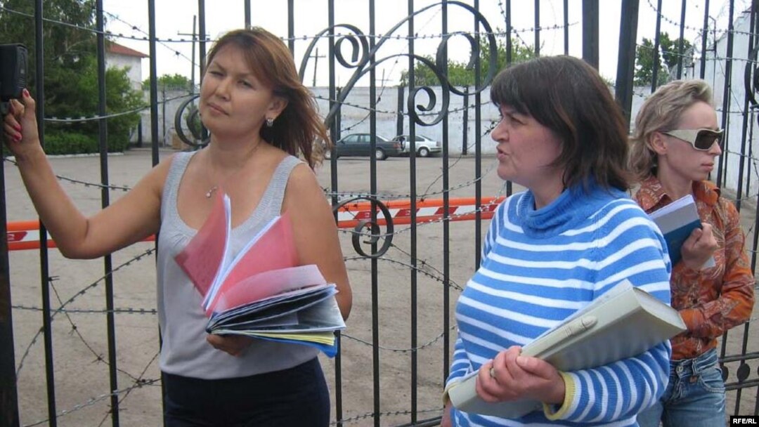Dzhamilya Dzhakisheva (left) waits with the wives of other Kazatomprom executives to see their husbands at the KNB detention center in Astana.