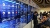 A screen displays preliminary results of Russia's parliamentary elections at the headquarters of the Central Election Commission in Moscow