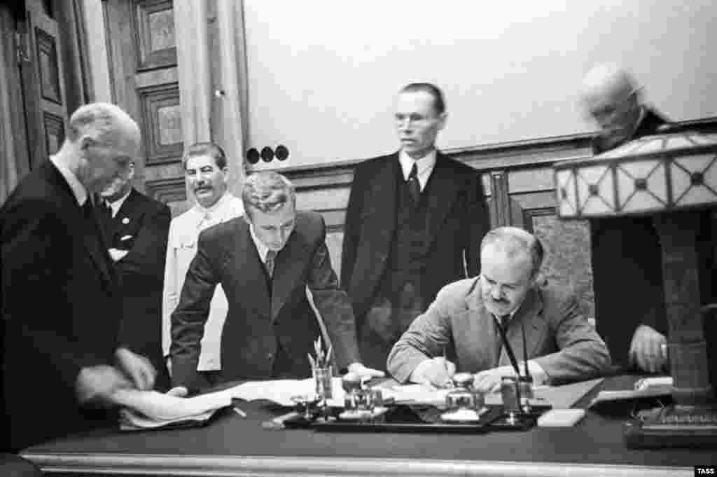 Molotov signs the treaty. For the Soviet Union, the pact bought time to rebuild its military before what appeared to be an inevitable conflict.