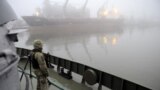 UKIRAINE -- Ukrainian soldier stands guard aboard military boat called "Dondass" moored in Mariupol, Sea of Azov port, November 27, 2018