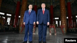 Chinese President Xi Jinping and US President Donald Trump visit the Temple of Heaven in Beijing on May 14.