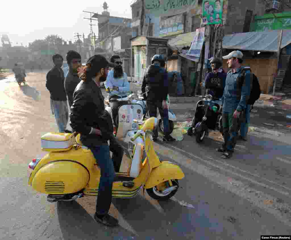 Members of a Vespa riders&#39; club gather at sunrise in Lahore.&nbsp;Piaggio&#39;s classic Italian two-wheeler was the ultimate status symbol for Pakistani bike aficionados in the 1960s and 70s when&nbsp; only a handful of people could afford the elegant machines.