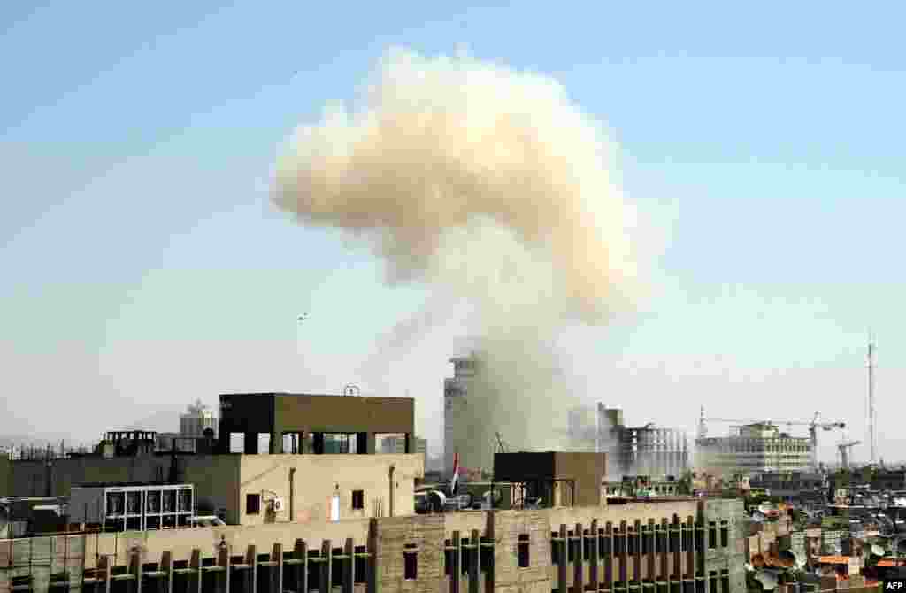 hakimiyyət qüvvələri Suriyanın paytaxt küçələrini bombaladıqları zaman çəkilmiş foto