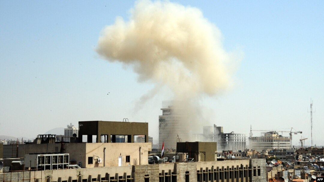 Smoke billows from the site of an apparent blast in the Marjeh district of Damascus on April 30.