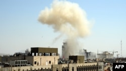 Smoke billows from the site of an apparent blast in the Marjeh district of Damascus on April 30.