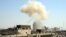 Smoke billows from the site of an apparent blast in the Marjeh district of Damascus on April 30.