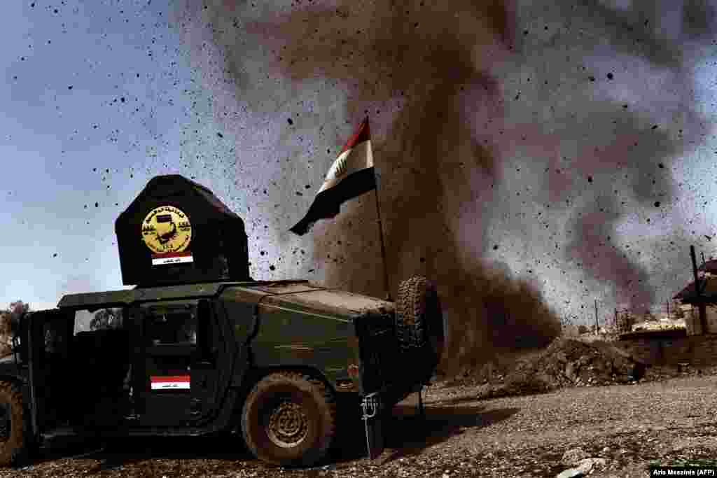 A mortar thrown by Islamic State militants explodes near an Iraqi Army vehicle on February 25. Mosul is where Islamic State leader Abu Bakr al-Baghdadi made his only public appearance, in July 2014, and proclaimed a &quot;caliphate,&quot; which then controlled a third of Iraq.&nbsp;