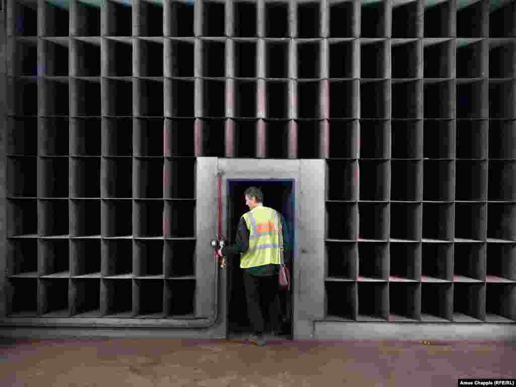 A subway worker walks through a wall of baffles designed to slow airflow within the Prague underground. A spokesperson for the Prague City Transport Company confirmed that with the OSM&#39;s limited capacity of less than a quarter of the Czech capital&#39;s 1.4 million population, &quot;it cannot be assumed that all residents will be sheltered in the metro&quot; in the event of war. &nbsp;