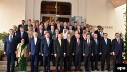 Delegates pose for a group photo during the Heart of Asia conference in Islamabad on December 9.