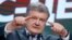Ukrainian President Petro Poroshenko gestures while speaking at his headquarters in Kyiv after the presidential voting on March 31.