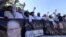 Supporters of former Prime Minister Nawaz Sharif shout slogans during a protest after an accountability court sentenced Nawaz Sharif to 10 years of imprisonment.