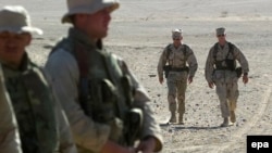 U.S. Defense Secretary James Mattis (second from right) when he was a Marine general, walking with troops in Afghanistan.